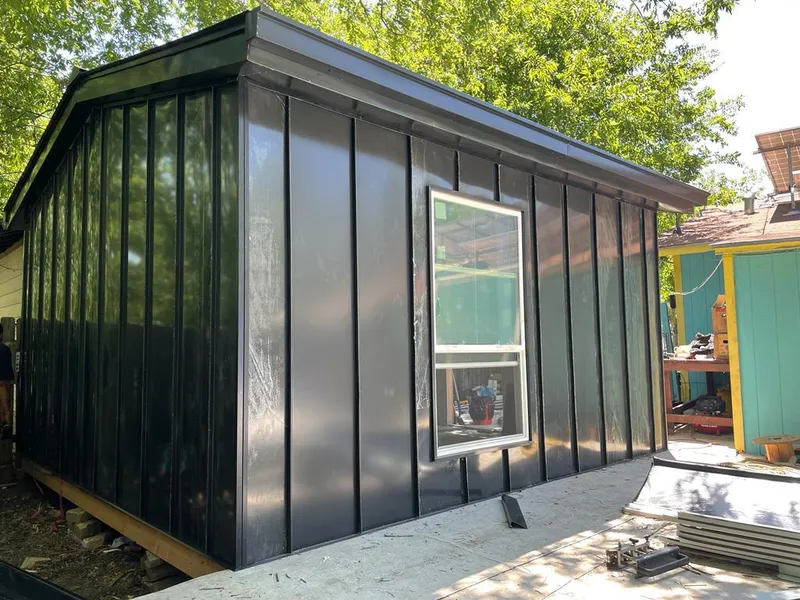 Black standing seam metal wall panels for Roof Inspection in Wood Dale